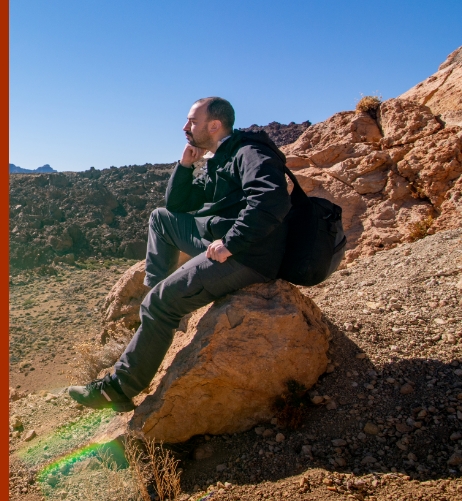 office man sitting in desert